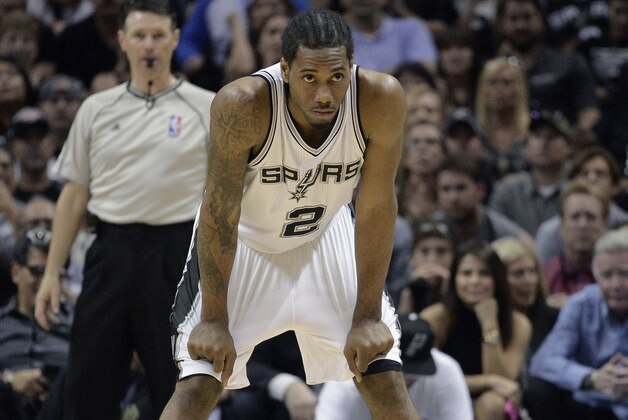 San Antonio Spurs forward Kawhi Leonard stands on the court during the second half of Game 4 in an NBA basketball first-round playoff series against the Los Angeles Clippers, Sunday, April 26, 2015, in San Antonio. Los Angeles won 114-105. (AP Photo/Darren Abate)