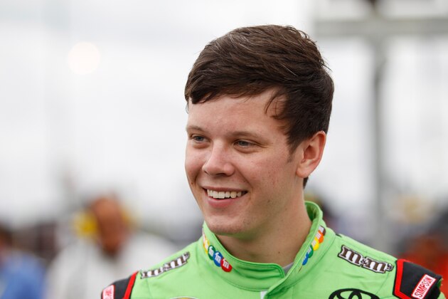 KANSAS CITY, KS - MAY 09:  Erik Jones, driver of the #18 M&M's Red Nose Day Toyota, stands on pit road before the start of the NASCAR Sprint Cup Series SpongeBob SquarePants 400 at Kansas Speedway on May 9, 2015 in Kansas City, Kansas.  (Photo by Kena Krutsinger/Getty Images)