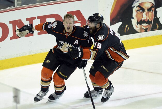 May 10, 2015; Anaheim, CA, USA; Anaheim Ducks right wing Corey Perry (10) celebrates with left wing Patrick Maroon (19) after scoring the game winning goal during overtime against the Calgary Flames in game five of the second round of the 2015 Stanley Cup Playoffs at Honda Center. The Anaheim Ducks won 3-2. Mandatory Credit: Kelvin Kuo-USA TODAY Sports