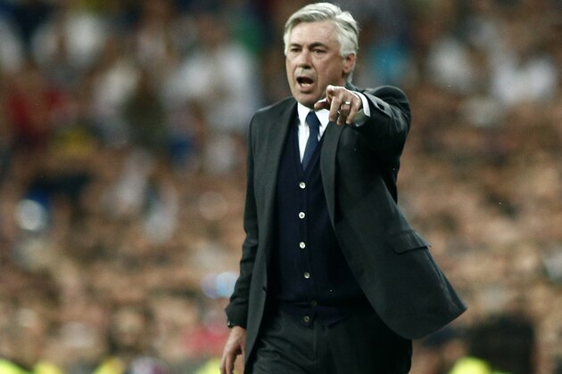 Real Madrid's coach Carlo Ancelotti gestures during a Spanish La Liga soccer match against Valencia at the Santiago Bernabeu stadium in Madrid, Spain, Saturday May 9, 2015. (AP Photo/Oscar del Pozo)