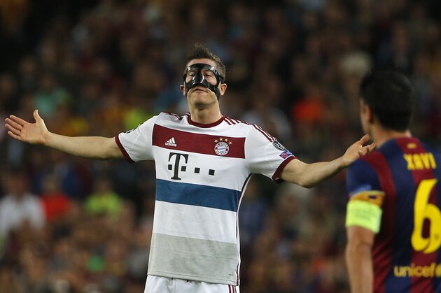 Bayern's Robert Lewandowski reacts during the Champions League semifinal first leg soccer match between Barcelona and Bayern Munich at the Camp Nou stadium in Barcelona, Spain, Wednesday, May 6, 2015.  Barcelona won 3-0. (AP Photo/Emilio Morenatti)