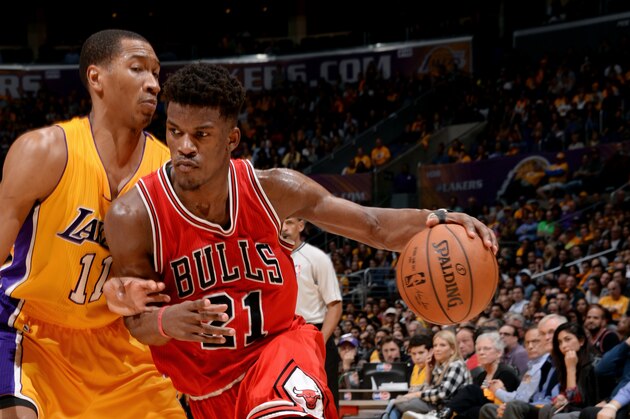 LOS ANGELES, CA - JANUARY 29: Jimmy Butler #21 of the Chicago Bulls drives against Wesley Johnson #11 of the Los Angeles Lakers at STAPLES Center on January 29, 2015 in Los Angeles, California. NOTE TO USER: User expressly acknowledges and agrees that, by downloading and/or using this Photograph, user is consenting to the terms and conditions of the Getty Images License Agreement. Mandatory Copyright Notice: Copyright 2015 NBAE (Photo by Andrew D. Bernstein/NBAE via Getty Images)