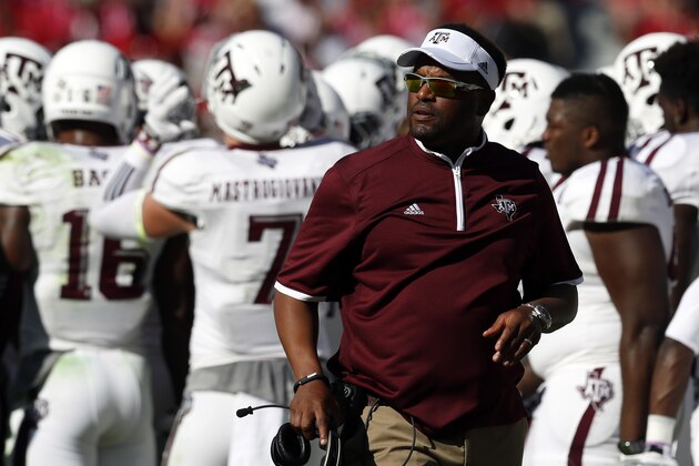 Texas A&M head coach Kevin Sumlin walks the sideline during the first half of an NCAA college football game against Alabama, Saturday, Oct. 18, 2014, in Tuscaloosa, Ala. (AP Photo/Butch Dill)