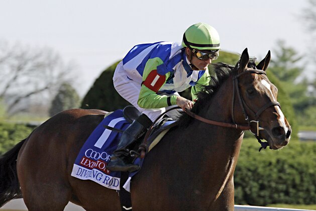 Jockey Julien Leparoux rides Divining Rod to a three-length victory in the Lexington Stakes horse race at Keeneland in Lexington, Ky., Saturday, April 11, 2015. (AP Photo/Garry Jones)