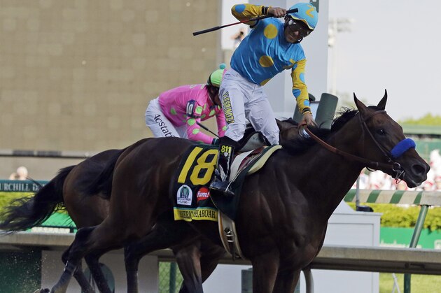 Victor Espinoza rides American Pharoah to victory in the 141st running of the Kentucky Derby horse race at Churchill Downs Saturday, May 2, 2015, in Louisville, Ky. (AP Photo/Brynn Anderson)