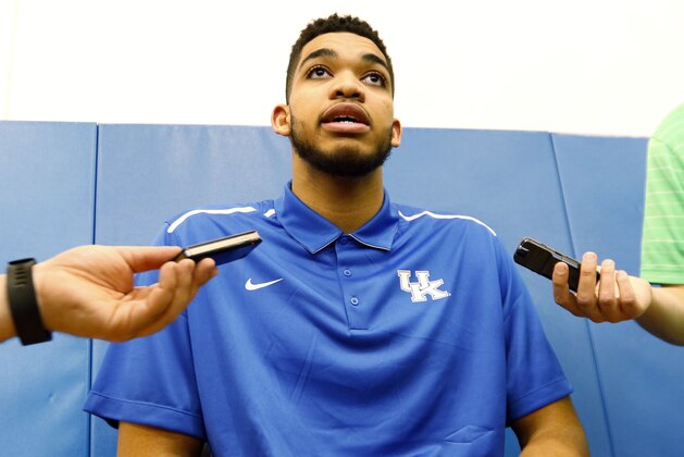 Kentucky NCAA college basketball player Karl-Anthony Towns speaks to reporters after announcing his intent to place his name in the NBA draft during a news conference at the Joe Craft Center, Thursday, April 9, 2015, in Lexington, Ky. (AP Photo/James Crisp)