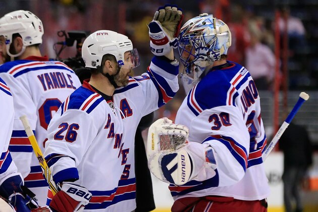 WASHINGTON, DC - MAY 10: Martin St. Louis and Henrik Lundqvist #30 of the New York Rangers celebrate following their 4-3 win over the Washington Capitals during Game Six of the Eastern Conference Semifinals during the 2015 NHL Stanley Cup Playoffs at Verizon Center on May 10, 2015 in Washington, DC.  (Photo by Rob Carr/Getty Images)