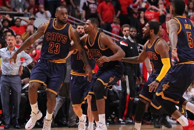 May 10, 2015; Chicago, IL, USA; Cavaliers Cavaliers forward LeBron James (23) celebrates with teammates after scoring the game winning basket in the second half of game four of the second round of the NBA Playoffs against the Chicago Bulls at the United Center. The Cavaliers won 86-84. Mandatory Credit: Dennis Wierzbicki-USA TODAY Sports