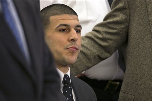 Former New England Patriots football player Aaron Hernandez listens as the guilty verdict is read during his murder trial at the Bristol County Superior Court in Fall River, Mass., Wednesday, April 15, 2015.  Hernandez was found guilty of first-degree murder in the shooting death of Odin Lloyd in June 2013.  He faces a mandatory sentence of life in prison without parole.  (Dominick Reuter/Pool Photo via AP)