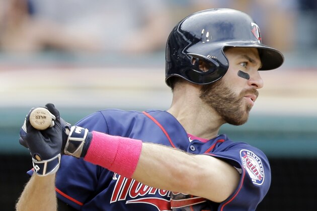 Minnesota Twins' Joe Mauer hits an RBI-single off Cleveland Indians relief pitcher Cody Allen in the ninth inning of a baseball game, Sunday, May 10, 2015, in Cleveland. Torii Hunter scored on the play. The Indians defeated the Twins 8-2. (AP Photo/Tony Dejak)