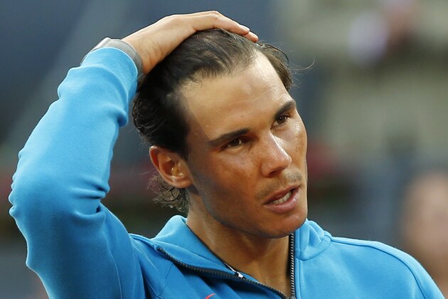 Rafael Nadal of Spain makes a speech after losing to Andy Murray of Britain during the men's final at the Madrid Open Tennis tournament in Madrid, Spain, Sunday, May 10, 2015. (AP Photo/Paul White)