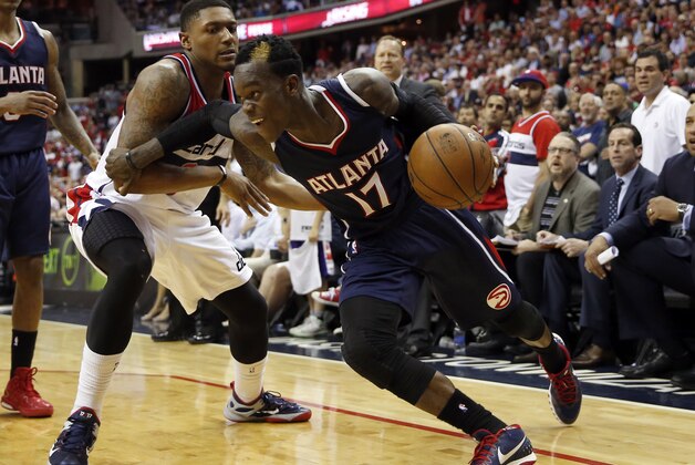 Atlanta Hawks guard Dennis Schroder (17), from Germany, drives around Washington Wizards guard Bradley Beal in the second half of Game 4 of the second round of the NBA basketball playoffs Monday, May 11, 2015, in Washington. The Hawks won 106-101. (AP Photo/Alex Brandon)