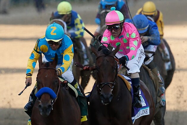 LOUISVILLE, KY - MAY 02:  American Pharoah #18, ridden by Victor Espinoza, races Firing Line #10, ridden by Gary Stevens, down the frontstretch to the finish line during the 141st running of the Kentucky Derby at Churchill Downs on May 2, 2015 in Louisville, Kentucky.  (Photo by Rob Carr/Getty Images)