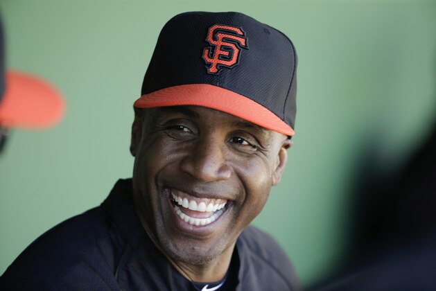 FILE - In this March 10, 2014, file photo, former San Francisco Giants Barry Bonds chats to the dugout during a spring training baseball game in Scottsdale, Ariz. Bonds gets another attempt to overturn his obstruction of justice conviction when an 11-judge panel of the 9th U.S. Circuit Court of Appeals hears arguments in his case Thursday, Sept. 18, 2014.  (AP Photo/Chris Carlson, File)