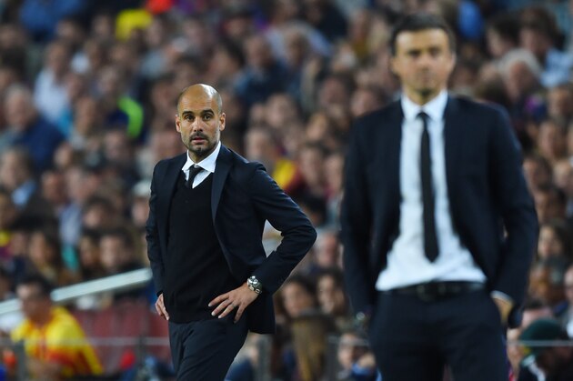 BARCELONA, SPAIN - MAY 06:  A dejected Josep Guardiola the head coach of Bayern Muenchen looks on past Luis Enrique the head coach of Barcelona during the UEFA Champions League Semi Final, first leg match between FC Barcelona and FC Bayern Muenchen at Camp Nou on May 6, 2015 in Barcelona, Spain.  (Photo by Shaun Botterill/Getty Images)