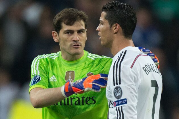 MADRID, SPAIN - MARCH 10: goalkeeper Iker Casillas (L) of Real Madrid CF holds his teammate Cristiano Ronaldo (R) after loosing the UEFA Champions League round of 16 second leg match between Real Madrid CF and FC Schalke 04 at Estadio Santiago Bernabeu on March 10, 2015 in Madrid, Spain.  (Photo by Gonzalo Arroyo Moreno/Getty Images)