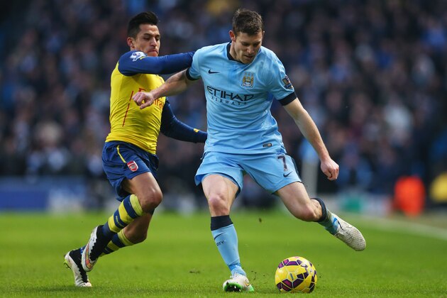 MANCHESTER, ENGLAND - JANUARY 18:  Alexis Sanchez of Arsenal tackles James Milner of Manchester City during the Barclays Premier League match between Manchester City and Arsenal at Etihad Stadium on January 18, 2015 in Manchester, England.  (Photo by Alex Livesey/Getty Images)