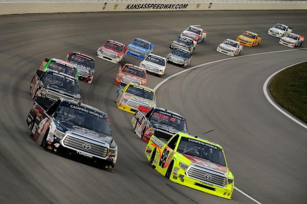KANSAS CITY, KS - MAY 08:  Matt Crafton, driver of the #88 Slim Jim/Menards Toyota, and Erik Jones, driver of the #4 Toyota Toyota, lead the field during the NASCAR Camping World Truck Series Toyota Tundra 250 at Kansas Speedway on May 8, 2015 in Kansas City, Kansas.  (Photo by Ed Zurga/Getty Images)