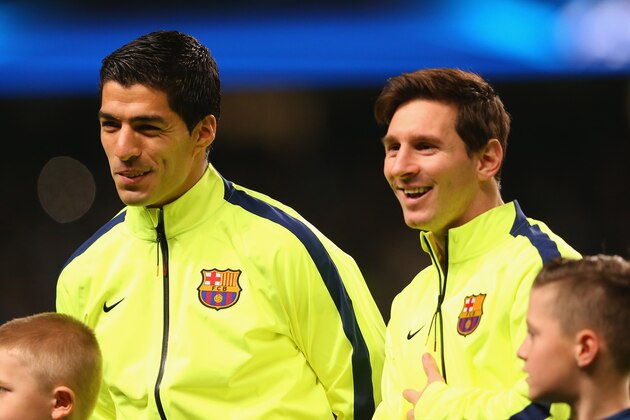 MANCHESTER, ENGLAND - FEBRUARY 24:  Luis Suarez and Lionel Messi of Barcelona share a joke as the teams line up during the UEFA Champions League Round of 16 match between Manchester City and Barcelona at Etihad Stadium on February 24, 2015 in Manchester, United Kingdom.  (Photo by Alex Livesey/Getty Images)