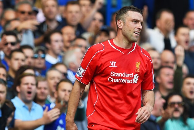 LONDON, ENGLAND - MAY 10:  Rickie Lambert of Liverpool is haranged by the chelsea fans after colliding with Thibaut Courtois of Chelsea during the Barclays Premier League match between Chelsea and Liverpool at Stamford Bridge on May 10, 2015 in London, England.  (Photo by Shaun Botterill/Getty Images)