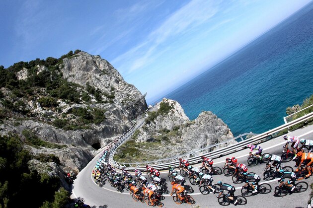 Cyclists compete during the second stage of the Giro d'Italia, Tour of Italy cycling race from Albenga to Genoa, Italy, Sunday, May 10, 2015. Elia Viviani timed his sprint to perfection to win the second stage of the Giro d'Italia Sunday, while Michael Matthews moved into the overall lead on a day dominated by crashes. (Claudio Peri/ANSA via AP)