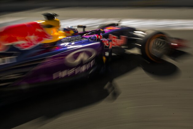 Infiniti Red Bull driver Australia's Daniel Ricciardo leaves boxes during the first practice session for the Spain Formula One Grand Prix at the Barcelona Catalunya racetrack in Montmelo, just outside Barcelona, Spain, Friday, May 8, 2015. (AP Photo/Andres Kudacki)