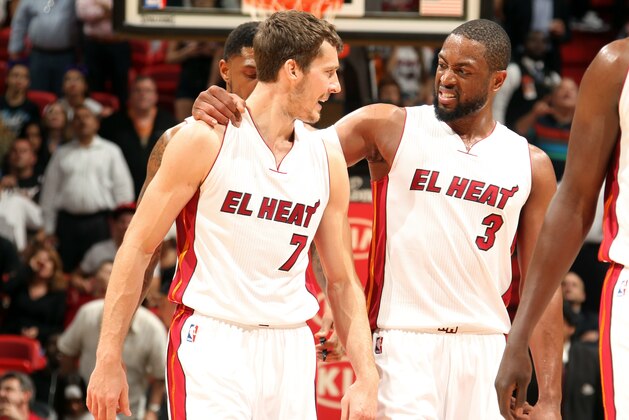 MIAMI, FL - MARCH 2: Goran Dragic #7 and Dwyane Wade #3 of the Miami Heat celebrate during a game against the Phoenix Suns on March 2, 2015 at American Airlines Arena in Miami, Florida.  NOTE TO USER: User expressly acknowledges and agrees that, by downloading and or using this Photograph, user is consenting to the terms and conditions of the Getty Images License Agreement. Mandatory Copyright Notice: Copyright 2015 NBAE (Photo by Issac Baldizon/NBAE via Getty Images)