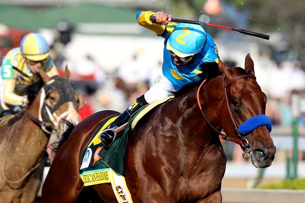 LOUISVILLE, KY - MAY 02:  American Pharoah #18, ridden by Victor Espinoza, comes out of turn 4 during the 141st running of the Kentucky Derby at Churchill Downs on May 2, 2015 in Louisville, Kentucky.  (Photo by Andy Lyons/Getty Images)