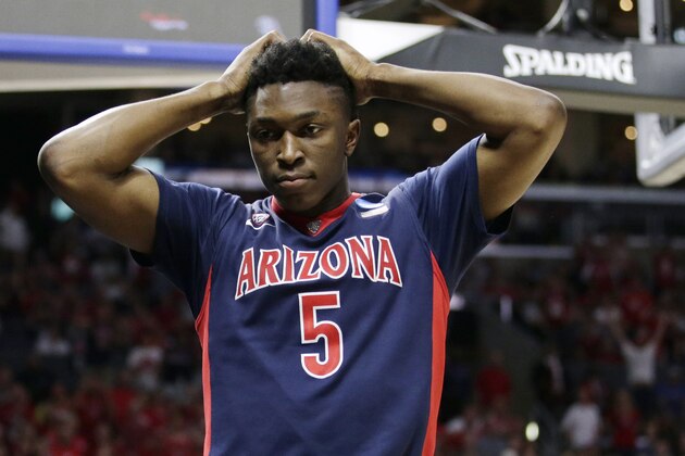 Arizona forward Stanley Johnson reacts after being called for a foul during the second half of a college basketball regional final against Wisconsin in the NCAA Tournament, Saturday, March 28, 2015, in Los Angeles. (AP Photo/Jae C. Hong)