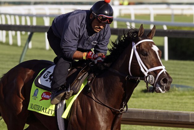 Kentucky Derby hopeful Materiality, ridden by exercise rider Carlos Cano, gallops during a morning workout at Churchill Downs in Louisville, Ky., Monday, April 27, 2015.  (AP Photo/Garry Jones)