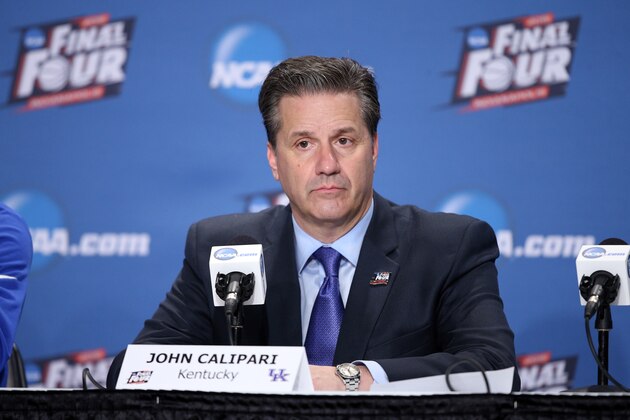 INDIANAPOLIS, IN - APRIL 04:  Head coach John Calipari of the Kentucky Wildcats looks on in the post game press conference after being defeated by the Wisconsin Badgers during the NCAA Men's Final Four Semifinal at Lucas Oil Stadium on April 4, 2015 in Indianapolis, Indiana. Wisconsin defeated Kentucky 71-64.  (Photo by Joe Robbins/Getty Images)