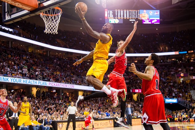 CLEVELAND, OH - MAY 12: LeBron James #23 of the Cleveland Cavaliers shoots over Joakim Noah #13 and Derrick Rose #1 of the Chicago Bulls in the first half during Game Five in the Eastern Conference Semifinals of the 2015 NBA Playoffs 2015 at Quicken Loans Arena on May 12, 2015 in Cleveland, Ohio. NOTE TO USER: User expressly acknowledges and agrees that, by downloading and or using this photograph, User is consenting to the terms and conditions of the Getty Images License Agreement. (Photo by Jason Miller/Getty Images)