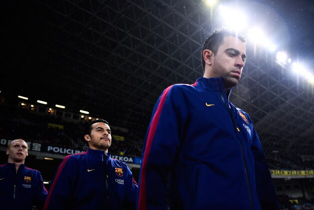 SAN SEBASTIAN, SPAIN - JANUARY 04:  Xavi Hernandez of FC Barcelona walks on the pitch during the La Liga match between Real Sociedad de Futbol and FC Barcelona at Estadio Anoeta on January 4, 2015 in San Sebastian, Spain.  (Photo by David Ramos/Getty Images)