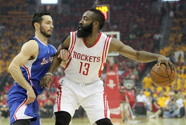 May 12, 2015; Houston, TX, USA; Houston Rockets guard James Harden (13) dribbles against Los Angeles Clippers guard J.J. Redick (4) in the first quarter in game five of the second round of the NBA Playoffs. at Toyota Center. Mandatory Credit: Thomas B. Shea-USA TODAY Sports