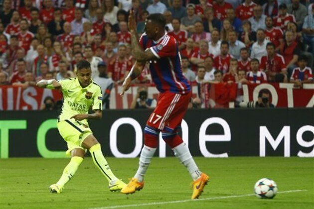 Barcelona's Neymar, left, scores his side's second goal during the soccer Champions League second leg semifinal match between Bayern Munich and FC Barcelona at Allianz Arena in Munich, southern Germany, Tuesday, May 12, 2015. (AP Photo/Matthias Schrader)