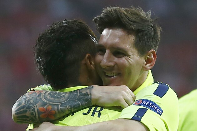 Barcelona's Neymar, left, is congratulated by his teammate Lionel Messi after scoring his side's first goal during the soccer Champions League second leg semifinal match between Bayern Munich and FC Barcelona at Allianz Arena in Munich, southern Germany, Tuesday, May 12, 2015. (AP Photo/Matthias Schrader)