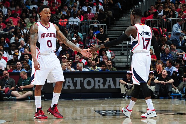 ATLANTA, GA - APRIL 7:  Jeff Teague #0 and Dennis Schroder #17 of the Atlanta Hawks shake hands during the game against the Phoenix Suns on April 7, 2015 at Philips Arena in Atlanta, Georgia.  NOTE TO USER: User expressly acknowledges and agrees that, by downloading and/or using this Photograph, user is consenting to the terms and conditions of the Getty Images License Agreement. Mandatory Copyright Notice: Copyright 2015 NBAE (Photo by Scott Cunningham/NBAE via Getty Images)