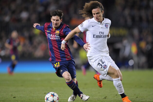 Barcelona's Lionel Messi, left, fights for the ball with PSG's David Luiz during the Champions League quarterfinal second leg soccer match between FC Barcelona and Paris Saint Germain at the Camp Nou Stadium in Barcelona, Spain, Tuesday, April 21, 2015. (AP Photo/Manu Fernandez)
