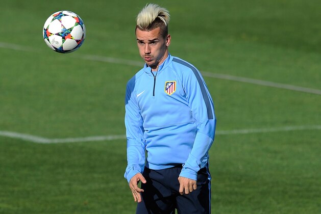 MADRID, SPAIN - APRIL 21: Antoine Griezmann and Raul Garcia of Club Atletico de Madrid heads the ball during the Club Atletico de Madrid training ahead of the UEFA Champions League, 2nd Leg match between Club Atletico de Madrid and Real Madrid on April 21, 2015 in Madrid, Spain. (Photo by Denis Doyle/Getty Images) MADRID, SPAIN - APRIL 21: Antoine Griezmann and Raul Garcia of Club Atletico de Madrid heads the ball during the Club Atletico de Madrid training ahead of the UEFA Champions League, 2nd Leg match between Club Atletico de Madrid and Real Madrid on April 21, 2015 in Madrid, Spain. (Photo by Denis Doyle/Getty Images)