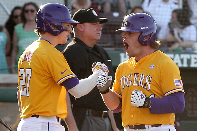 LSU's Beau Jordan, right celebrates the tying run in the ninth inning with Danny Zardon, (27) during their NCAA college baseball game against Mississippi State in Starkville, Miss., Saturday, May. 2, 2015. (AP Photo/Jim Lytle)
