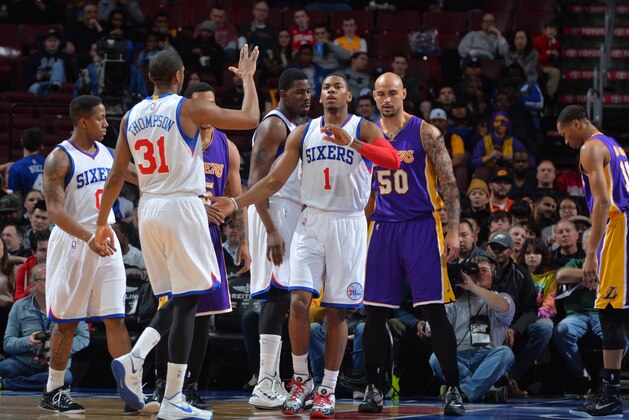 PHILADELPHIA,PA - MARCH 30: Isaiah Canaan #0 , Hollis Thompson #31 and Glenn Robinson III #1 of the Philadelphia 76ers shake hands after a play against the Los Angeles Lakers at Wells Fargo Center on March 30, 2015 in Philadelphia, Pennsylvania NOTE TO USER: User expressly acknowledges and agrees that, by downloading and/or using this Photograph, user is consenting to the terms and conditions of the Getty Images License Agreement. Mandatory Copyright Notice: Copyright 2015 NBAE (Photo by Jesse D. Garrabrant/NBAE via Getty Images)