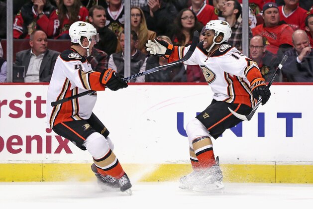CHICAGO, IL - OCTOBER 28:  Devante Smith-Pelly #12 of the Anaheim Ducks (R) celebrates his unassisted, short-handed goal with Cam Fowler #4 in the third period against the Chicago Blackhakws at the United Center on October 28, 2014 in Chicago, Illinois. The Ducks defeated the Blackhawks 1-0.  (Photo by Jonathan Daniel/Getty Images)