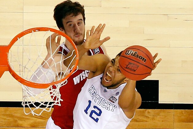 INDIANAPOLIS, IN - APRIL 04: Karl-Anthony Towns #12 of the Kentucky Wildcats drives to the basket against Frank Kaminsky #44 of the Wisconsin Badgers in the second half during the NCAA Men's Final Four Semifinal at Lucas Oil Stadium on April 4, 2015 in Indianapolis, Indiana.  (Photo by Andy Lyons/Getty Images)