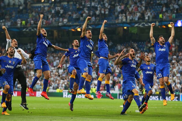 MADRID, SPAIN - MAY 13:  Juventus players celebrate following their progression to the final during the UEFA Champions League Semi Final, second leg match between Real Madrid and Juventus at Estadio Santiago Bernabeu on May 13, 2015 in Madrid, Spain.  (Photo by Alex Livesey/Getty Images)