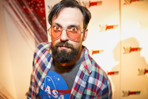 IMAGE DISTRIBUTED FOR 2K - WWE Superstar Damien Sandow, dressed as a stereotypical gamer, at the WWE 2K15 Press Event at Cicada Restaurant, on Saturday, August 16, 2014 in Los Angeles. (Photo by Colin Young-Wolff/Invision for 2K/AP Images)