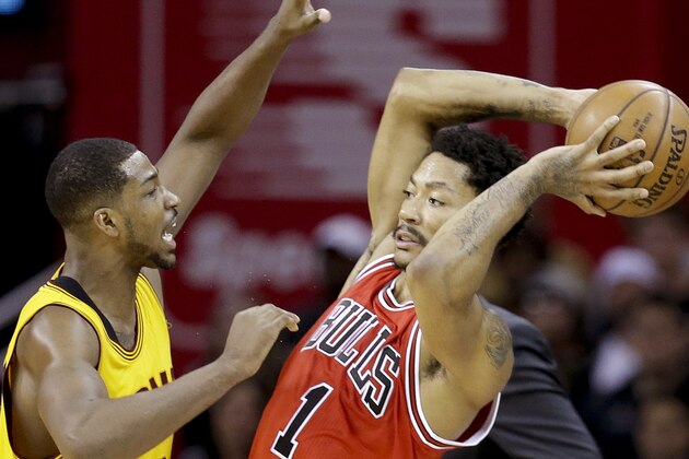 Chicago Bulls guard Derrick Rose (1) looks to pass against Cleveland Cavaliers center Tristan Thompson (13) during the second half of Game 5 in a second-round NBA basketball playoff series Tuesday, May 12, 2015, in Cleveland. (AP Photo/Tony Dejak)