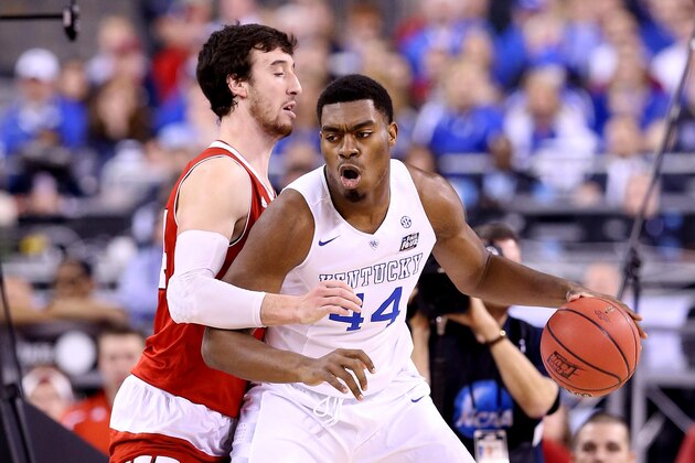 INDIANAPOLIS, IN - APRIL 04: Dakari Johnson #44 of the Kentucky Wildcats handles the ball against Frank Kaminsky #44 of the Wisconsin Badgers in the first half during the NCAA Men's Final Four Semifinal at Lucas Oil Stadium on April 4, 2015 in Indianapolis, Indiana.  (Photo by Andy Lyons/Getty Images)