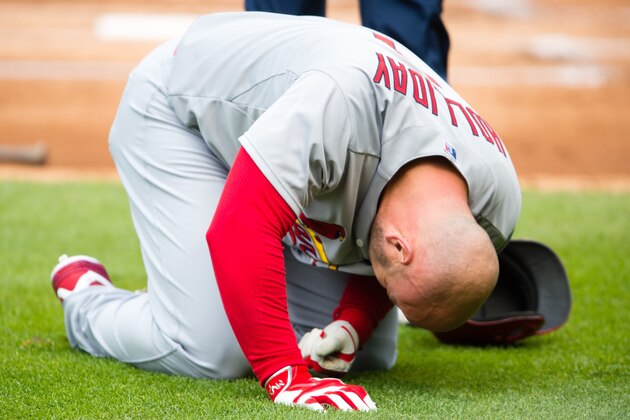 CLEVELAND, OH -  MAY 13: Matt Holliday #7 of the St. Louis Cardinals reacts after being hit by a pitch during the first inning  by starting pitcher Corey Kluber #28 of the Cleveland Indians at Progressive Field on May 13, 2015 in Cleveland, Ohio. (Photo by Jason Miller/Getty Images)