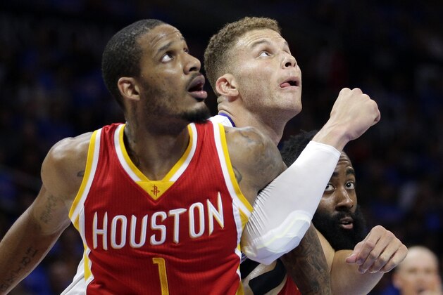 Houston Rockets forward Trevor Ariza, left, Los Angeles Clippers forward Blake Griffin, center, and Rockets guard James Harden battle for a rebound during the first half in Game 4 of a second-round NBA basketball playoff series, Sunday, May 10, 2015, in Los Angeles. (AP Photo/Jae C. Hong)