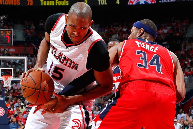 ATLANTA, GA - MAY 13:  Al Horford #15 of the Atlanta Hawks draws a foul from Paul Pierce #34 of the Washington Wizards during Game Five of the Eastern Conference Semifinals of the 2015 NBA Playoffs at Philips Arena on May 13, 2015 in Atlanta, Georgia.  NOTE TO USER: User expressly acknowledges and agrees that, by downloading and/or using this photograph, user is consenting to the terms and conditions of the Getty Images License Agreement.  (Photo by Kevin C. Cox/Getty Images)